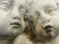 Pair of Carved Marble Cherub Faces